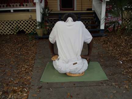 Half padmasana from the back